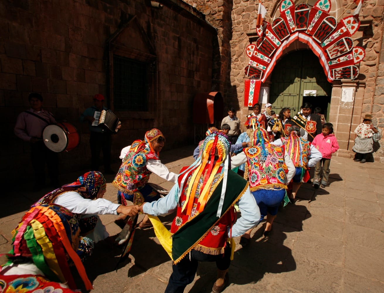 Multiple Peru festival participants celebrating