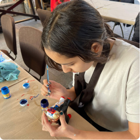 Painting a “Torito de Pucará” at Lake Huaypo